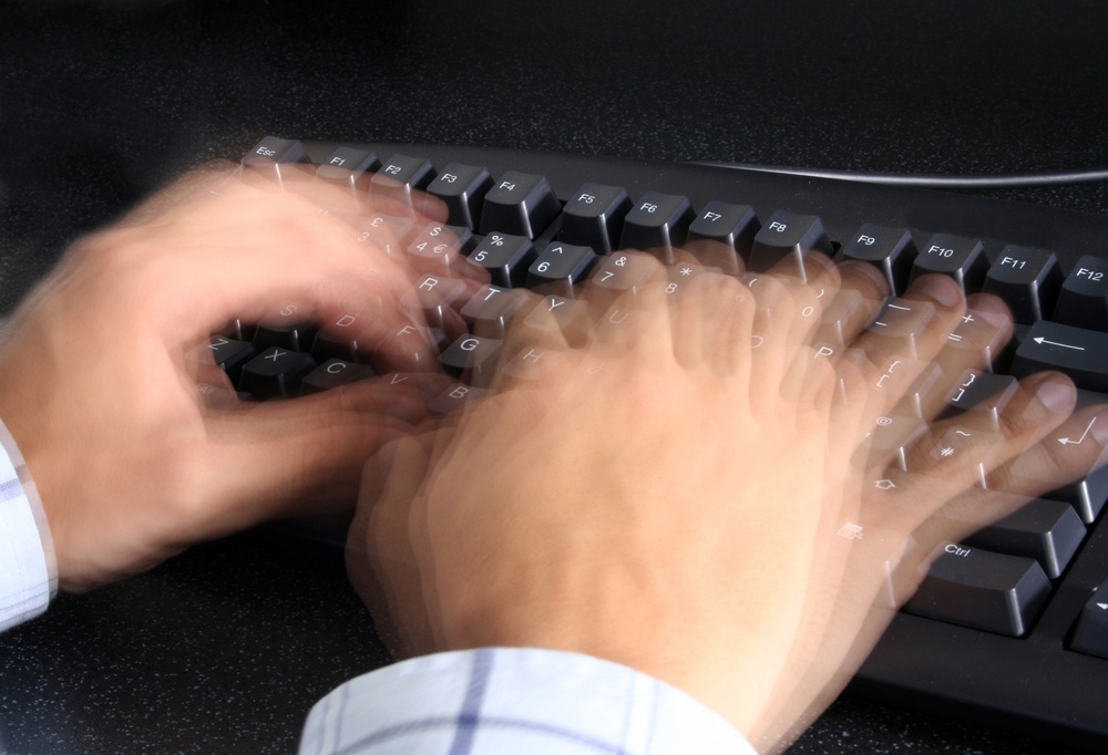 person typing incredibly fast on a keyboard.jpeg